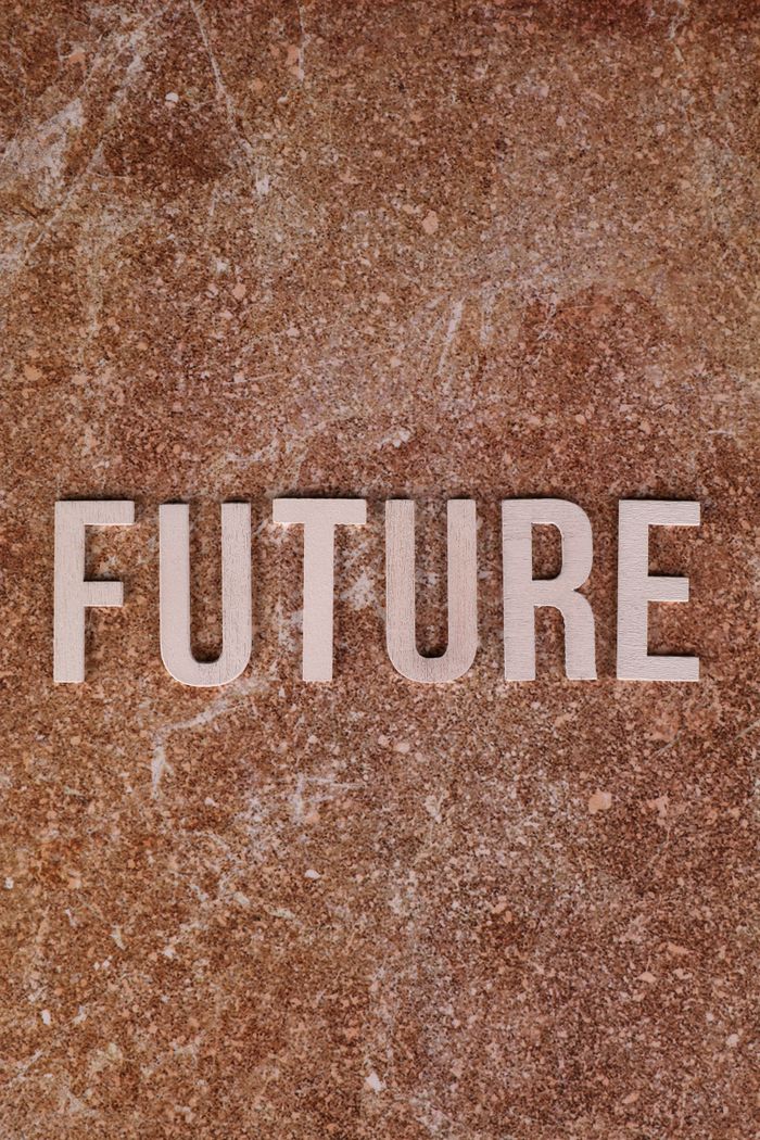 High angle view of the word 'FUTURE' on a textured surface. Creative concept for motivation.
